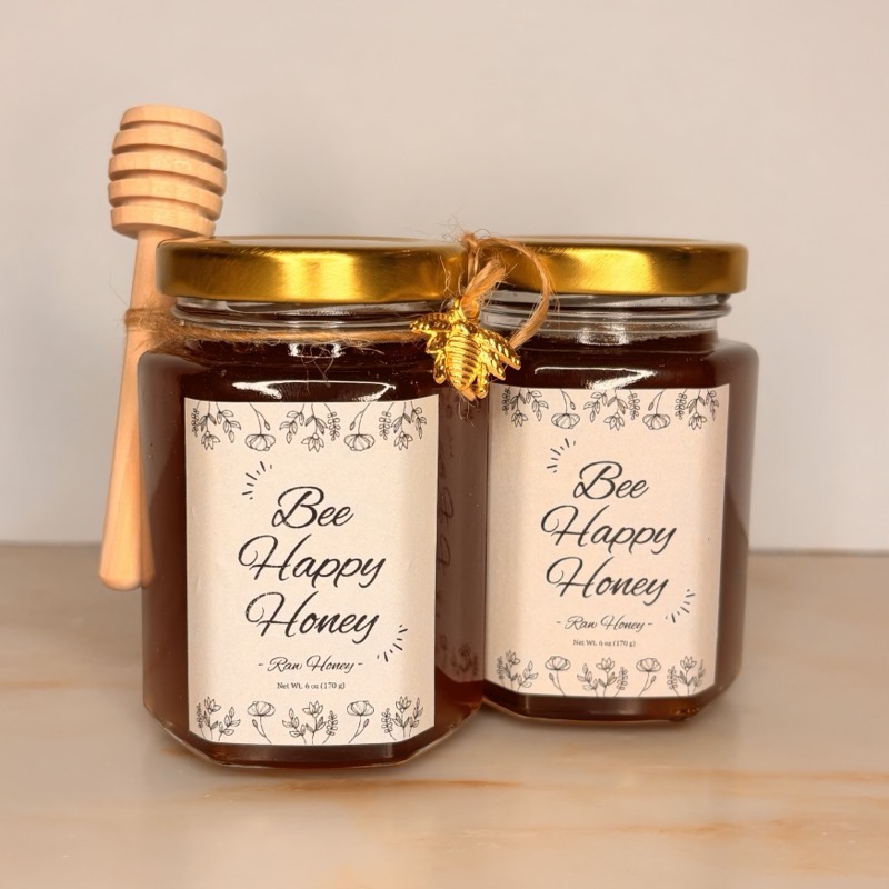 Two jars of Bee Happy Honey raw honey