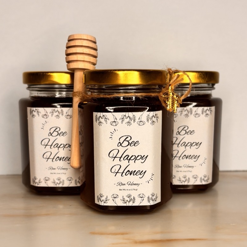 Three jars of Bee Happy Honey raw honey